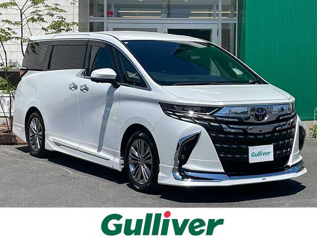 トヨタ アルファードハイブリット Z 青森県 2023(令5)年 3.9万km プラチナホワイトパールマイカ 純正14インチDオーディオプラスナビ・フルセグTV/パノラミックビューモニター/OP純正12.1インチフリップダウンモニター/OPトヨタチームメイト/OP左右独立ムーンルーフ/OPユニバーサルステップ/OPデジタルインナーミラー/OPカラーヘッドアップディスプレイ/黒合皮シート/前席・2列目エアシート・ヒーター/両側パワースライドドア/パワーバックドア/ステアリングヒーター/セーフティセンス/プリクラッシュセーフティ/レーダークルーズコントロール/レーントレーシングアシスト/レーンディパーチャーアラート/アダプティブハイビーム/ブラインドスポットモニター/パーキングサポートブレーキ/前後ドライブレコーダー/ビルトインETC2.0/AC100V1500W/おくだけ充電/純正フロアマット/3眼LEDヘッドランプ/LEDフォグランプ/純正18インチアルミ/OPモデリスタエアロ/OPモデリスタシグネチャーイルミブレード/OPモデリスタフロントグリル
