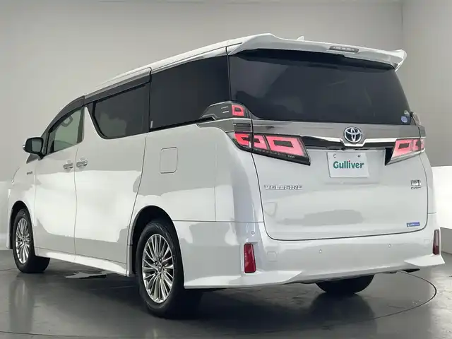 トヨタ ヴェルファイア ハイブリット ZR Gエディション 愛知県 2019(平31)年 6.2万km ホワイトパールクリスタルシャイン 純９型ナビ　フルセグＴＶ　全方位カメラ　ＪＢＬサウンド　デジタルインナーミラー　純１２型後席モニター　パワーバックドア　両側電動スライドドア　温・冷シート　黒革　３眼ＬＥＤオートライト　ＢＳＭ　禁煙車/ETC２．０　ドラレコ　1・2列目シートヒーター　オートハイビーム　追従クルコン　衝突軽減　メモリ付きパワーシート　オットマン　Bluetooth　HDMI端子　後席エアコン