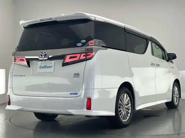 トヨタ ヴェルファイア ハイブリット ZR Gエディション 愛知県 2019(平31)年 6.2万km ホワイトパールクリスタルシャイン 純９型ナビ　フルセグＴＶ　全方位カメラ　ＪＢＬサウンド　デジタルインナーミラー　純１２型後席モニター　パワーバックドア　両側電動スライドドア　温・冷シート　黒革　３眼ＬＥＤオートライト　ＢＳＭ　禁煙車/ETC２．０　ドラレコ　1・2列目シートヒーター　オートハイビーム　追従クルコン　衝突軽減　メモリ付きパワーシート　オットマン　Bluetooth　HDMI端子　後席エアコン