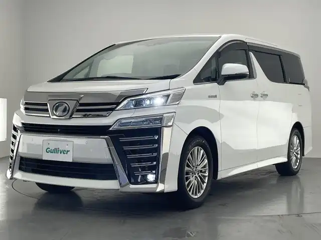 トヨタ ヴェルファイア ハイブリット ZR Gエディション 愛知県 2019(平31)年 6.2万km ホワイトパールクリスタルシャイン 純９型ナビ　フルセグＴＶ　全方位カメラ　ＪＢＬサウンド　デジタルインナーミラー　純１２型後席モニター　パワーバックドア　両側電動スライドドア　温・冷シート　黒革　３眼ＬＥＤオートライト　ＢＳＭ　禁煙車/ETC２．０　ドラレコ　1・2列目シートヒーター　オートハイビーム　追従クルコン　衝突軽減　メモリ付きパワーシート　オットマン　Bluetooth　HDMI端子　後席エアコン