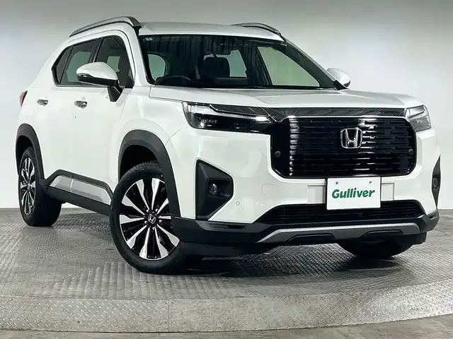 ホンダ ＷＲ－Ｖ Z+ 神奈川県 2024(令6)年 1万km 白 純正8インチナビ　【LXM-245ZFEi】/-AM/FM/Bluetooth/フルセグTV/iPod/USB/バックカメラ　/ホンダセンシング　/衝突軽減ブレーキ　/誤発信抑制機能　/後方誤発信抑制機能　/路外逸脱抑制機能　/アダプティブクルーズコントロール　/車線維持支援システム　/先行車発進お知らせ機能　/オートマチックハイビーム　/前後パーキングセンサー/パドルシフト　/革巻きステアリング　/前後ドラレコ　/ETC　/純正フロアマット　/フォグランプ　/ヘッドライトレベライザー　/スマートキー