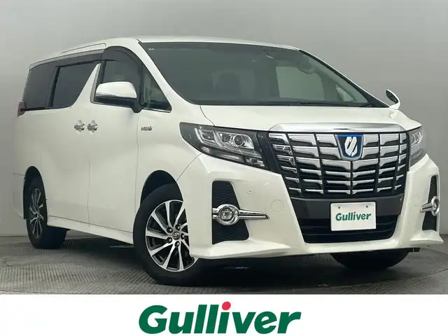 トヨタ アルファードハイブリット SR 道央・札幌 2015(平27)年 6万km ホワイトパールクリスタルシャイン ・4WD/・純正9インチナビ/・フルセグ/BT/CD/DVD/・両側パワースライドドア/・パワーシート/・シートメモリ/・クルーズコントロール/・社外ドライブレコーダー前後/・オートブレーキホールド/・ドアロック連動ミラー/・コーナーセンサー/・プッシュスタート/・スマートキー/・LEDヘッドライト/・オートライト/・オートエアコン/・横滑り防止装置