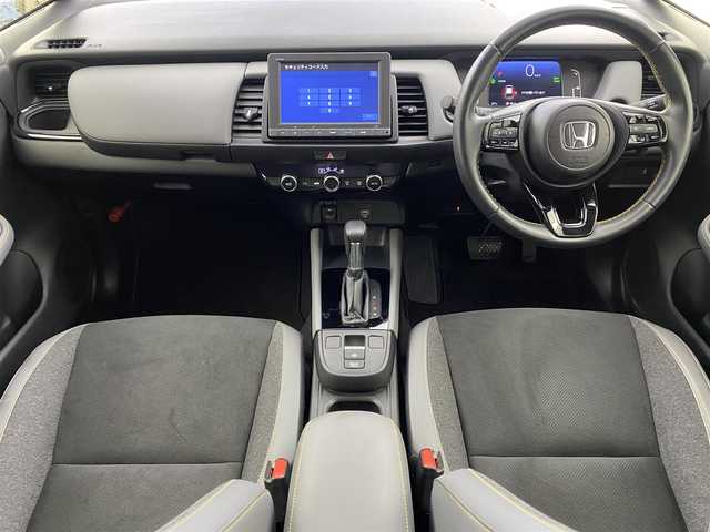 ホンダ フィット e:HEV RS 愛知県 2023(令5)年 2.1万km プレミアムサンライトホワイトパール ・純正8インチナビ/・バックカメラ/・Bluetooth/・フルセグTV/・ホンダセンシング/・衝突被害軽減システム/・クルーズコントロール/・レーンキープアシスト/・コーナーセンサー/・オートライト/・ドライブレコーダー/・ETC/・純正AW/・プッシュスタート/・スマートキー/・スペアキー