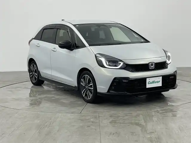 ホンダ フィット e:HEV RS 愛知県 2023(令5)年 2.1万km プレミアムサンライトホワイトパール ・純正8インチナビ/・バックカメラ/・Bluetooth/・フルセグTV/・ホンダセンシング/・衝突被害軽減システム/・クルーズコントロール/・レーンキープアシスト/・コーナーセンサー/・オートライト/・ドライブレコーダー/・ETC/・純正AW/・プッシュスタート/・スマートキー/・スペアキー