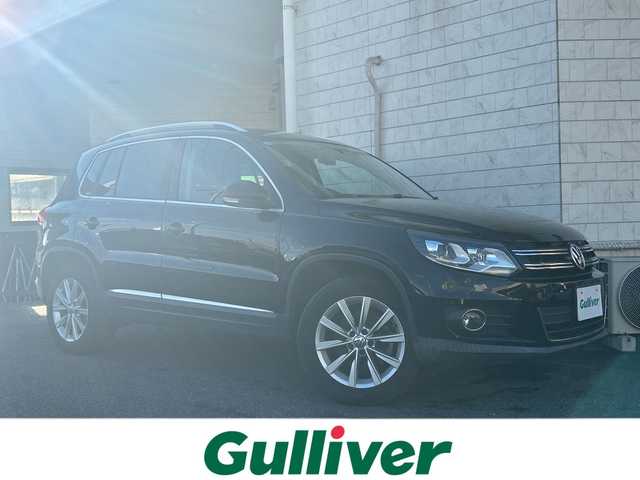 フォルクスワーゲン ティグアン TSI Bモーションテクノロジー 神奈川県 2013(平25)年 5万km ディープブラックパールエフェクト 純正ナビ/（CD/DVD/AM/FM/SD/USB/BT/ワンセグTV)/バックカメラ/前後ドライブレコーダー/ETC/クルーズコントロール/コーナーセンサー/横滑り防止装置/ABS/アイドリングストップ/オートライト/ISOFIX/ルーフレール/純正フロアマット/純正アルミホイール/スペアキー×２/保証書/取扱説明書