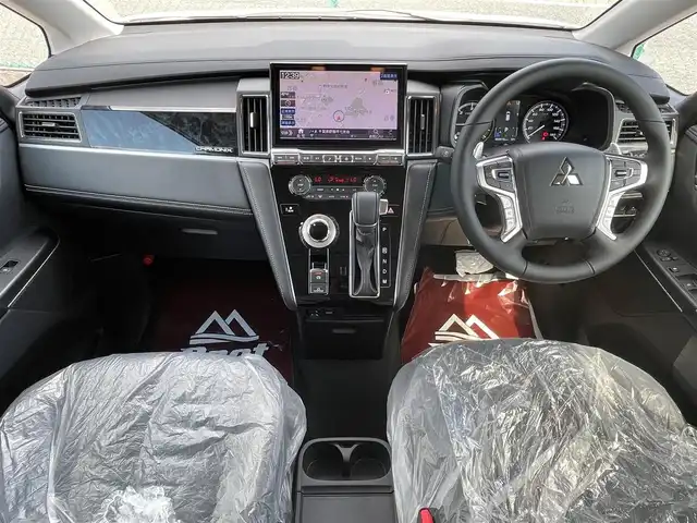 三菱 デリカＤ：５ シャモニー 千葉県 2025(令7)年 0.1千km 白Ⅱ AIS検査済み/【2506031454】社外パーツ取付有/Brat新車仕入カスタム/リフトアップキット（社外）/WEDSマッドヴァンス07新品アルミホイール（社外）/ヨコハマジオランダーX-ATホワイトレター新品タイヤ（社外）/MADLYSヘッドライトプロテクター（社外）/TGSモディファイドフェイスマスク（社外）/BUSTERSルーフラック（社外）/デリカD:5専用ALPINE BIG X11インチナビ【EX11NX】/フルセグTV（走行中映像視聴不可）/Bluetooth/CD/DVD/HDMI/USB/全方位カメラ/オートクルーズコントロール/両側パワースライドドア/エレクトリックリアゲート/ハンドルヒーター/前席シートヒーター/AC100V電源/8人乗り・ディーゼル