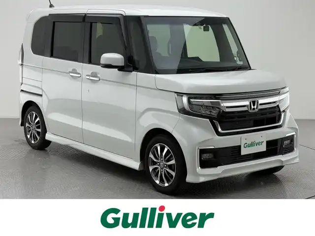 ホンダ Ｎ ＢＯＸ カスタム L 兵庫県 2022(令4)年 9.6万km プラチナホワイトパール 社外メモリナビ/（CD/DVD/SD/Bluetooth/フルセグTV）/・MDV-D709BT/バックカメラ/アダクティブクルーズコントロール/LKA/プリクラッシュセーフティー/クリアランスソナー/横滑り防止装置/盗難防止装置/カーテンエアバッグ/両側パワースライドドア/シートヒーター（D/N席）/両側パワースライドドア/LEDヘッドライト/LEDフォグランプ/オートライト/ヘッドライトレベライザー/ETC/ドライブレコーダー（前後）/純正14インチアルミホイール/社外フロアマット/スマートキー/スペアー1本/ベンチシート