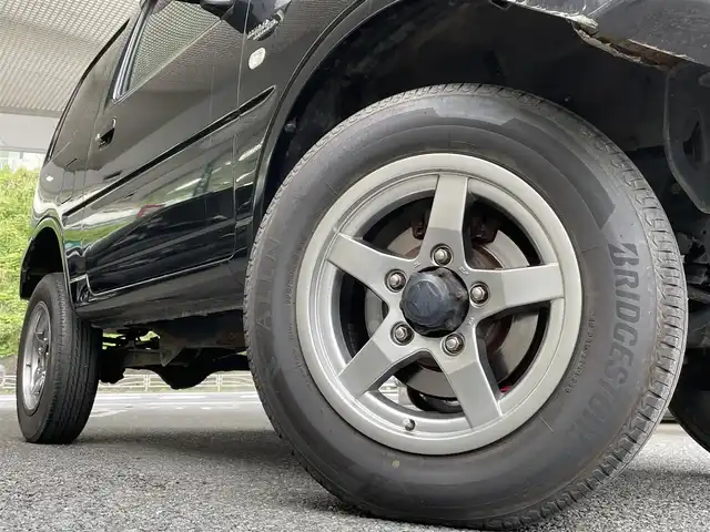 スズキ ジムニー ワイルドウィンド 神奈川県 2007(平19)年 12.2万km ブルーイッシュブラックパール3 KENWOODラジオ/ターボ/4WD/ルーフレール/運転席シートヒーター/ドアバイザー/社外フロアマット/純正16インチアルミホイール/純正ハロゲンヘッドライト/新車時保証書/取扱説明書