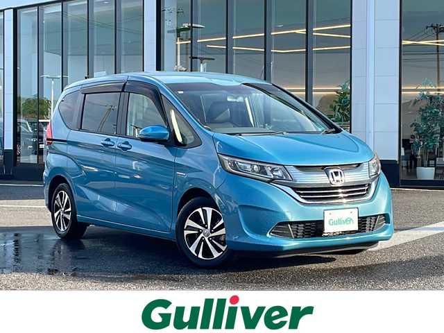 ホンダ フリード ハイブリット G ホンダセンシング 新潟県 2016(平28)年 5.2万km ブルーホライゾンM 社外メモリナビ/（BT／AM／FM／DVD）/バックカメラ/フルセグTV/ステアリングスイッチ/片側電動自動ドア（左）/ビルトインETC/クルーズコントロール/衝突軽減システム/レーンキープアシスト/LEDヘッドライト/オートライト/ドアバイザー/シガーソケット/スマートキー