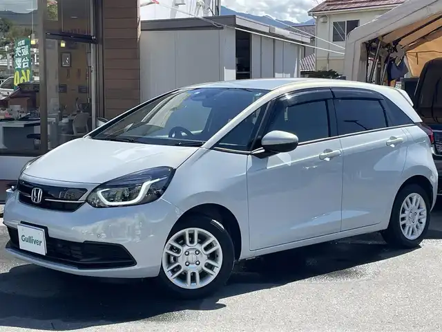 ホンダ フィット ホーム 長野県 2022(令4)年 1.6万km プレミアムサンライトホワイトパール ワンオーナー/純正ナビ/・Bluetooth/TV/CD/DVD/フロントカメラ/バックカメラ/純正ETC/クルーズコントロール追走あり/純正ドライブレコーダー前後/ハーフレザーシート/純正フロアマット/社外15インチAW/LEDオートライト/純正ドアバイザー/スペアキー1本/取り扱い説明書/保証書