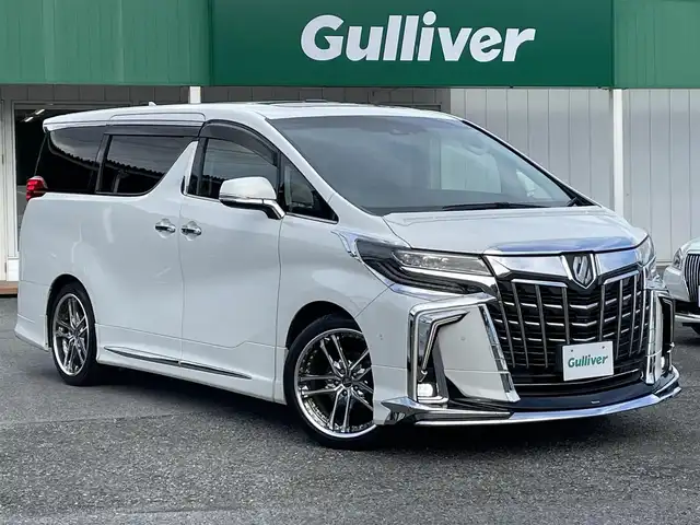 トヨタ アルファード S Cパッケージ 千葉県 2020(令2)年 7.4万km ホワイトパールクリスタルシャイン モデリスタエアロ(F/S/R)/モデリスタシグネチャーイルミブレード/サンルーフ/黒レザーシート/JBLプレミアムサウンドシステム/純正ディスプレイオーディオ/・ナビ/CD/DVD/MSV/Bluetooth/フルセグ/純正リアエンターテイメントシステム/パノラミックビューカメラ/両後パワースライドドア/パワーバックドア/デジタルインナーミラー/前席パワーシート/前席シートヒーター/前席シートベンチレーション/スマートキー/ステアリングヒーター/トヨタセーフティーセンス/・プリクラッシュセーフティー/・レーンキープアシスト/・パーキングサポートブレーキ/・ロードサインアシスト/・リヤクロストラフィックアラート/・ブラインドスポットモニター/・オートマチックハイビーム/・アダプティブクルーズコントロール/パーキングアシスト/前後コーナーセンサー/ウッドコンビステアリング/三眼LEDヘッドライト/社外20インチアルミホイール/社外前後ドライブレコーダー【ZDR-025】/ビルトインETC2.0/サイド＆カーテンエアバッグ