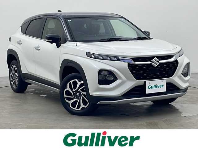スズキ フロンクス 秋田県 2024(令6)年 0.1千km パールⅡ 4WD/純正メモリナビ　/Bluetooth/AM/FM/AppleCarPlay/AndroidAuto/全方位カメラ　/デュアルセンサーブレーキサポートII　/レーダークルーズコントロール　/パドルシフト　/レーンキープアシスト/横滑り防止装置/アイドリングストップ/ヘッドアップディスプレイ/前席シートヒーター　/LEDヘッドライト　/フォグランプ/USBポート　/スペアキー/電動パーキング/オートホールド/ヒルディセントコントロール/ダウンヒルアシスト/ステアリングスイッチ/純正アルミホイール