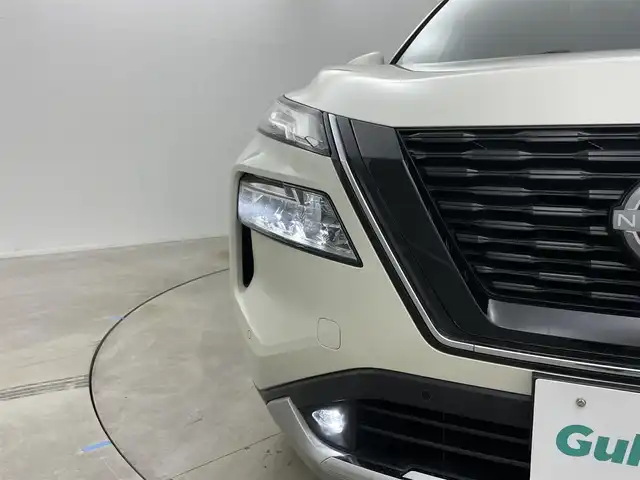日産 エクストレイル G e－4ORCE 岡山県 2023(令5)年 2.3万km ブリリアントホワイトパール 12.3インチナビ/地デジ/Bluetooth/USB/AppleCarPlay/アラウンドビューモニター/レザーシート/シートヒーター /ビルトインETC2.0/プロパイロット /置くだけ充電/ヘッドアップディスプレイ/ブラインドスポットモニター/パワーシート /パワーバックドア /エマージェンシーブレーキ/プッシュスタート /スマートキー/パーキングアシスト/AC100V電源/インテリジェントルームミラー/純正フロアマット/純正19インチアルミホイール/新車保証書