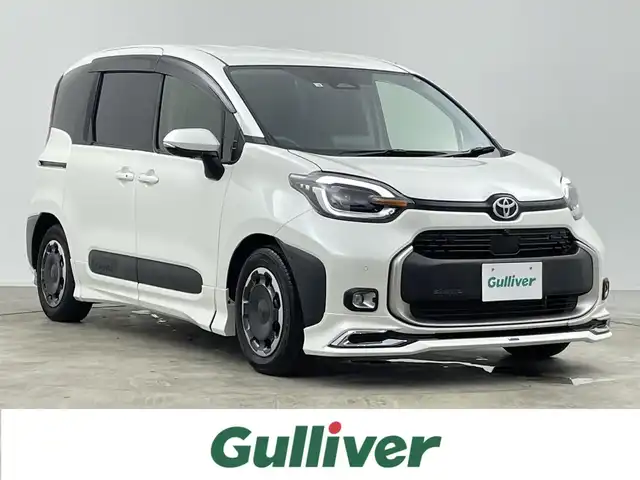 トヨタ シエンタ ハイブリッド Z 千葉県 2022(令4)年 0.9万km ホワイトパールクリスタルシャイン 禁煙車/トヨタセーフティセンス/・プリクラッシュセーフティ/・プリクラッシュセーフティブレーキ/・クリアランスソナー/・ブラインドスポットモニター/・レーンディパーチャーアラート/・レーンキープアシスト/・レーダークルーズコントロール/・パーキングアシスト/モデリスタエアロ/・フロント、サイド、リアスポイラー、リアアンダー）/両側電動ドア/純正10.5インチディスプレイオーディオ（ナビ付）/・USB/Bluetooth/フルセグTV/・ビルトインETC/・360度カメラ/革巻きステアリング/・ステアリングスイッチ/AC100電源/社外15インチAW/オートライト/・オートマチックハイビーム/・LEDヘッドライト/・フォグランプ/電動格納ウインカーミラー