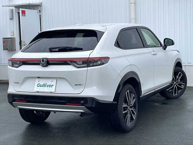 ホンダ ヴェゼル ハイブリッド e:HEV Z 三重県 2023(令5)年 1.6万km プラチナホワイトパール 禁煙車　/衝突軽減　/純正９型ナビ　/フルセグＴＶ　/バックカメラ　/レーダークルーズ　/レーンキープアシスト　/ステアリングヒーター　/シートヒーター　/パワーバックドア　/パドルシフト　/置くだけ充電　/USB充電/ブレーキホールド/ブラインドスポットモニター/フロントデアイサー
