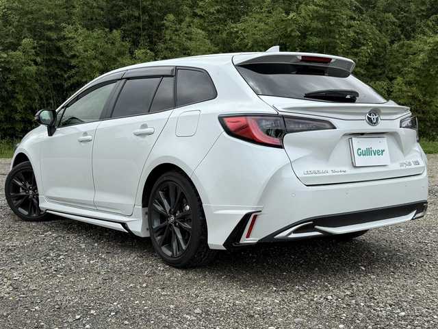 トヨタ カローラツーリング ハイブリッド ダブルバイビー 兵庫県 2022(令4)年 1.1万km プラチナホワイトパールマイカ ワンオーナー/モデリスタエアロ（F/S/RU）/TRDテールゲートスポイラー/純正10インチナビ/フルセグTV/バックモニター/ETC2.0/ハーフレザーシート/LEDヘッドライト/オートハイビーム/レーダークルコン/レーンキープ