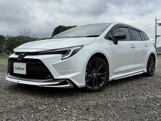 トヨタ カローラツーリング ハイブリッド ダブルバイビー 兵庫県 2022(令4)年 1.1万km プラチナホワイトパールマイカ ワンオーナー/モデリスタエアロ（F/S/RU）/TRDテールゲートスポイラー/純正10インチナビ/フルセグTV/バックモニター/ETC2.0/ハーフレザーシート/LEDヘッドライト/オートハイビーム/レーダークルコン/レーンキープ