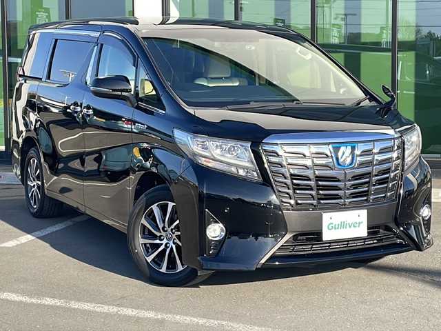 トヨタ アルファードハイブリット G 道東・釧路十勝 2015(平27)年 8.7万km ブラック ・４WD/・ALPINE１０インチナビ/（ＣＤ・ＤＶＤ・Ｂｌｕｅｔｏｏｔｈ・フルセグ・ラジオ）/・ALPINEフリップダウンモニター/・バッグカメラ　/・両側パワースライドドア/・クルーズコントロール　/・ドライブレコーダー/・ＥＴＣ/・ハーフレザーシート/・助手席オットマン/・セカンドシートオットマン/・純正１７インチアルミホイール　/・ＬＥＤヘッドライト