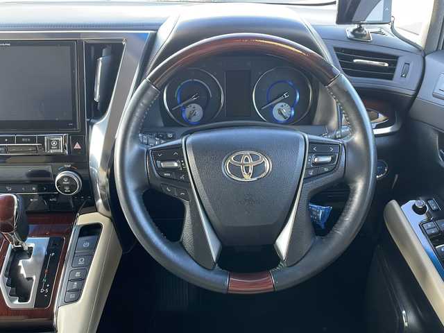 トヨタ アルファードハイブリット G 道東・釧路十勝 2015(平27)年 8.7万km ブラック ・４WD/・ALPINE１０インチナビ/（ＣＤ・ＤＶＤ・Ｂｌｕｅｔｏｏｔｈ・フルセグ・ラジオ）/・ALPINEフリップダウンモニター/・バッグカメラ　/・両側パワースライドドア/・クルーズコントロール　/・ドライブレコーダー/・ＥＴＣ/・ハーフレザーシート/・助手席オットマン/・セカンドシートオットマン/・純正１７インチアルミホイール　/・ＬＥＤヘッドライト