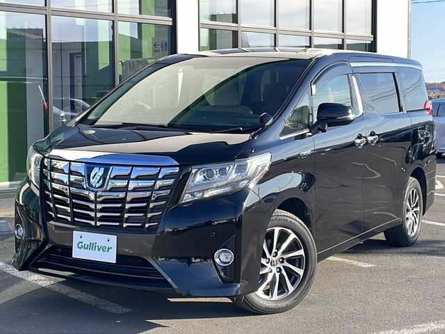 トヨタ アルファードハイブリット G 道東・釧路十勝 2015(平27)年 8.7万km ブラック ・４WD/・ALPINE１０インチナビ/（ＣＤ・ＤＶＤ・Ｂｌｕｅｔｏｏｔｈ・フルセグ・ラジオ）/・ALPINEフリップダウンモニター/・バッグカメラ　/・両側パワースライドドア/・クルーズコントロール　/・ドライブレコーダー/・ＥＴＣ/・ハーフレザーシート/・助手席オットマン/・セカンドシートオットマン/・純正１７インチアルミホイール　/・ＬＥＤヘッドライト