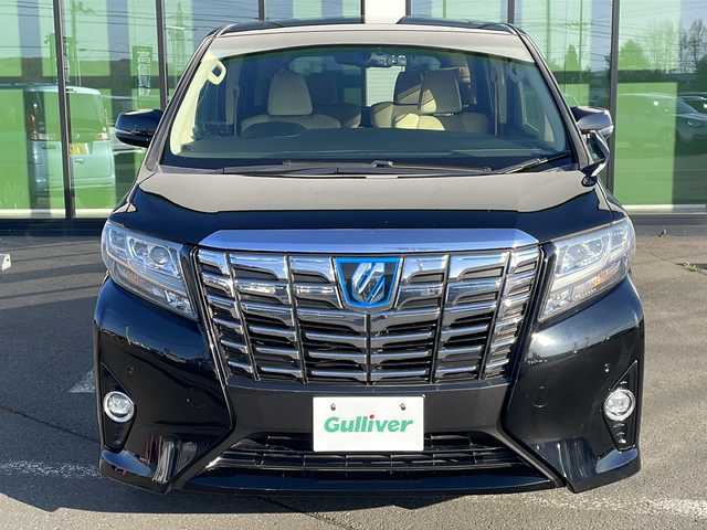 トヨタ アルファードハイブリット G 道東・釧路十勝 2015(平27)年 8.7万km ブラック ・４WD/・ALPINE１０インチナビ/（ＣＤ・ＤＶＤ・Ｂｌｕｅｔｏｏｔｈ・フルセグ・ラジオ）/・ALPINEフリップダウンモニター/・バッグカメラ　/・両側パワースライドドア/・クルーズコントロール　/・ドライブレコーダー/・ＥＴＣ/・ハーフレザーシート/・助手席オットマン/・セカンドシートオットマン/・純正１７インチアルミホイール　/・ＬＥＤヘッドライト