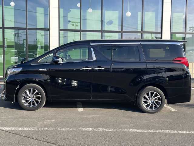 トヨタ アルファードハイブリット G 道東・釧路十勝 2015(平27)年 8.7万km ブラック ・４WD/・ALPINE１０インチナビ/（ＣＤ・ＤＶＤ・Ｂｌｕｅｔｏｏｔｈ・フルセグ・ラジオ）/・ALPINEフリップダウンモニター/・バッグカメラ　/・両側パワースライドドア/・クルーズコントロール　/・ドライブレコーダー/・ＥＴＣ/・ハーフレザーシート/・助手席オットマン/・セカンドシートオットマン/・純正１７インチアルミホイール　/・ＬＥＤヘッドライト