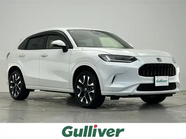 ホンダ ＺＲ－Ｖ ハイブリッド e:HEV Z 滋賀県 2024(令6)年 1.9万km プラチナホワイトパール 純正９インチナビ/(フルセグ/USB/Bluetooth/AppleCarPlay/AndroidAuto)/ＢＳＭ/BOSEプレミアムサウンド/全方位カメラ/ETC2.0/前後ドライブレコーダー/レザーシート/ＬＥＤ/シートヒーター/ステアリングヒーター/オートライト/オートハイビーム/レーダークルーズコントロール/パワーバックドア/電子パーキング/オートホールドブレーキ/プッシュスタート/スマートキー