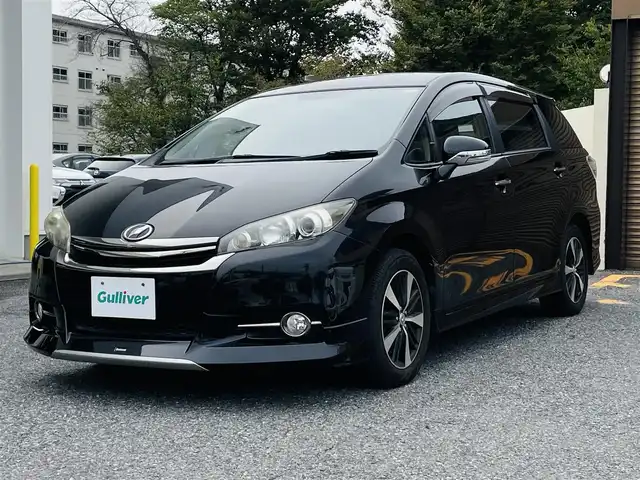 トヨタ ウィッシュ 1．8S モノトーン 千葉県 2015(平27)年 3万km ブラック メーカーナビ　【フルセグTV、Bluetooth、AMFMラジオ、CD】/16インチ純正アルミホイール/純正フロアマット/パドルシフト/全席ハーフレザーシート/全席パワーウィンドウ/ウィンカーミラー/電動格納ミラー/オートフロントライト/プッシュスタート/走行モード切替【エコモー/ドアバイザー/横滑り防止機能ド、パワーモード】/ビルドインETC/nanoe空調