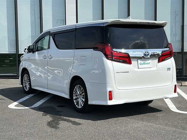 トヨタ アルファードハイブリット SR Cパッケージ 岐阜県 2020(令2)年 3.9万km ホワイトパールクリスタルシャイン 登録時走行距離38173km/純正１１型ナビ/フルセグＴＶ/バック＋サイドカメラ/サンルーフ(ダブルルーフ)/両側パワースライドドア/後席モニター(RXH12X-L)12.8型/プリクラッシュセーフティ/前後コーナーセンサー/２眼ＬＥＤヘッドライト/フォグランプ/ドライブレコーダー/４ＷＤ/スマートキー/プッシュスタート/レザーシート/パワーシート前席+2列目シート/シートヒーター前席/エアシート前席/ステアリングヒーター/HDMI/レーダー探知機/オットマン(助手席＋2列目シート)/純正17インチアルミホイール/補助ミラー