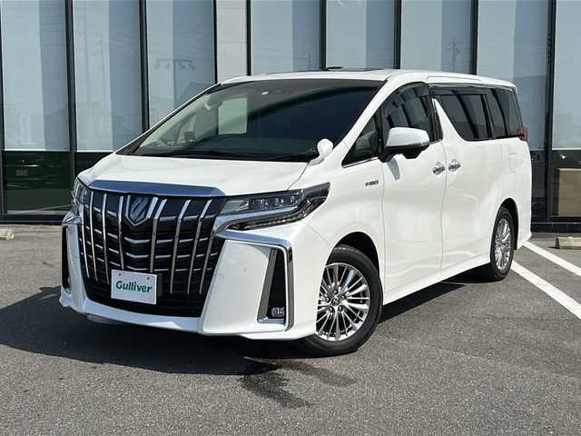 トヨタ アルファードハイブリット SR Cパッケージ 岐阜県 2020(令2)年 3.9万km ホワイトパールクリスタルシャイン 登録時走行距離38173km/純正１１型ナビ/フルセグＴＶ/バック＋サイドカメラ/サンルーフ(ダブルルーフ)/両側パワースライドドア/後席モニター(RXH12X-L)12.8型/プリクラッシュセーフティ/前後コーナーセンサー/２眼ＬＥＤヘッドライト/フォグランプ/ドライブレコーダー/４ＷＤ/スマートキー/プッシュスタート/レザーシート/パワーシート前席+2列目シート/シートヒーター前席/エアシート前席/ステアリングヒーター/HDMI/レーダー探知機/オットマン(助手席＋2列目シート)/純正17インチアルミホイール/補助ミラー
