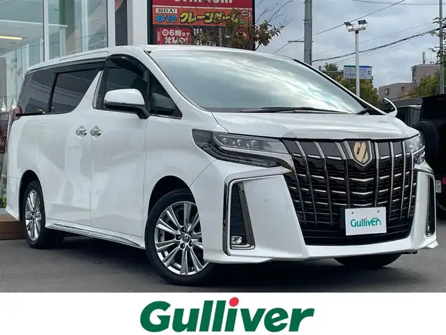 トヨタ アルファード S タイプゴールド 道央・札幌 2020(令2)年 5.9万km ホワイトパールクリスタルシャイン ・4WD/・寒冷地仕様/・衝突軽減ブレーキ/・純正ディスプレイオーディオ/CD&DVD&BT/・両側電動パワースライドドア/・パワーバックドア/・フリップダウンモニター/・ビルトインETC/・前後コーナーセンサー/・クリアランスソナー(後ろのみ)/・レーダークルーズコントロール/・ハーフレザーシート/・ウォークスルー/・ABS/・アイドリングストップ/・レーンキープアシスト/・横滑り防止装置/・盗難防止装置/・オートライト/・オートマチックハイビーム/・3眼LEDヘッドライト/・純正AW付夏タイヤ/・エンジンスターター/・保証書/・取扱説明書