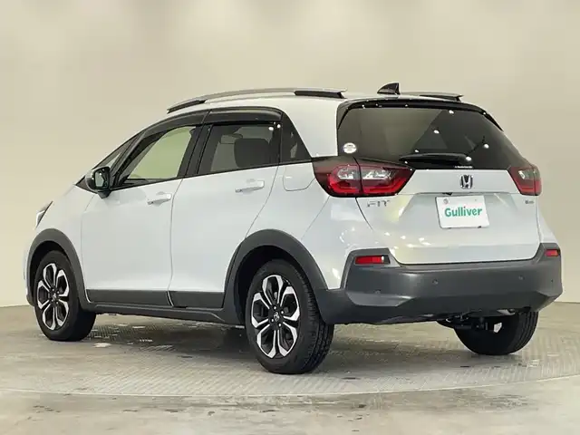 ホンダ フィット e:HEVクロスター 栃木県 2021(令3)年 2.5万km プレミアムサンライトホワイトパール 純正ナビ/(フルセグTV・Bluetooth・CD・DVD・SD・USB)/バックカメラ/ホンダセンシング/ ・衝突軽減システム/ ・レーンキープアシスト/ ・前後コーナーセンサー/ ・オートクルーズコントロール/前後ドライブレコーダー/ルーフレール/LEDヘッドライト/オートライト/純正16インチアルミホイール/純正フロアマット/ETC/スマートキー