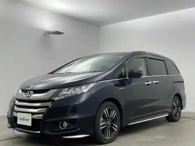 ホンダ オデッセイ ハイブリッド アブソルート EX パッケージ 岡山県 2016(平28)年 6.3万km プレミアムヴィーナスブラックP 純正ナビ　/全方位カメラ/バックカメラ/フルセグテレビ/CD/BT/USB/FM.AM/両側パワースライドドア/衝突軽減ブレーキ/車線逸脱防止機能/レーダークルーズコントロール/ビルトインETC/後席サンシェード/純正フロアマット/ドアバイザー/純正17インチアルミホイール/保証書/取扱説明書