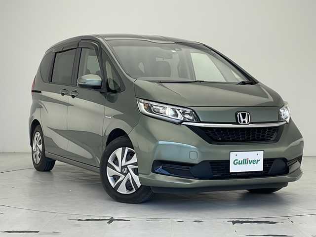 ホンダ フリード ハイブリット G ホンダセンシング 沖縄県 2020(令2)年 5.9万km シルバーミストグリーンM ワンオーナー/純正9インチナビ/CD/DVD/SD/BT/フルセグ/バックカメラ/両側パワースライドドア/ビルトインETC/衝突被害軽減システム/アダプティブクルーズコントロール/レーンキープアシスト/コーナーセンサー/前席シートヒーター/LEDヘッドライト/オートライト/MUGENドアハンドルプロテクター/純正ホイールキャップ/プッシュスタート/スマートキー