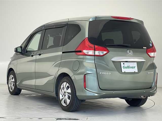 ホンダ フリード ハイブリット G ホンダセンシング 沖縄県 2020(令2)年 5.9万km シルバーミストグリーンM ワンオーナー/純正9インチナビ/CD/DVD/SD/BT/フルセグ/バックカメラ/両側パワースライドドア/ビルトインETC/衝突被害軽減システム/アダプティブクルーズコントロール/レーンキープアシスト/コーナーセンサー/前席シートヒーター/LEDヘッドライト/オートライト/MUGENドアハンドルプロテクター/純正ホイールキャップ/プッシュスタート/スマートキー