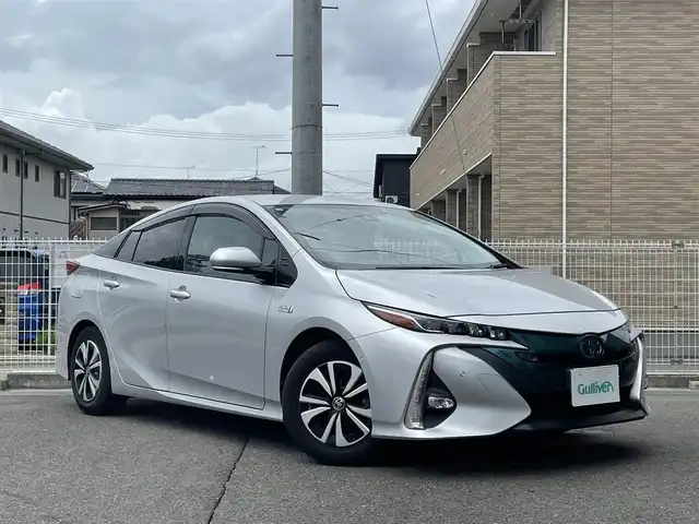 トヨタ プリウス ＰＨＶ A レザーパッケージ 福島県 2017(平29)年 2.1万km シルバーM ワンオーナー/Toyota Safety Sense P/11.6インチT‐Connectナビ/AM/FM/BT/USB/フルセグTV/純正15インチAW(社外AW＋冬タイヤ積込)/黒レザーシート/レーダークルーズコントロール/プリクラッシュセーフティ/ブラインドスポットモニター/バックカメラ/シートヒーター/パワーシート/ステアリングヒーター/ステアリングリモコン/オートハイビーム/LEDヘッドライト/フォグ/リアフォグ/純正ドライブレコーダー/ビルトインETC 2.0/プッシュスタート/ドアバイザー/フロアマット