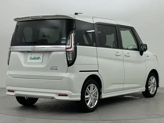 スズキ ソリオ HV MZ 新潟県 2021(令3)年 2.1万km ピュアホワイトP スズキセーフティサポート/禁煙車/ワンオーナー/純正9インチメモリナビ/　　CD/DVD/AM/FM/BT/フルセグ//　　applecarplay/androidauto/アラウンドビューモニター/両側パワースライドドア/アダプティブクルーズコントロール/LEDオートライト/前席シートヒーター/純正15インチアルミホイール付/ステアリングスイッチ/サーキュレーター/アイドリングストップ/ヘッドアップディスプレイ/USBポート/社外ドライブレコーダー/後席パーソナルテーブル/後席ロールサンシェード/スペアキー/スマートキー/ETC