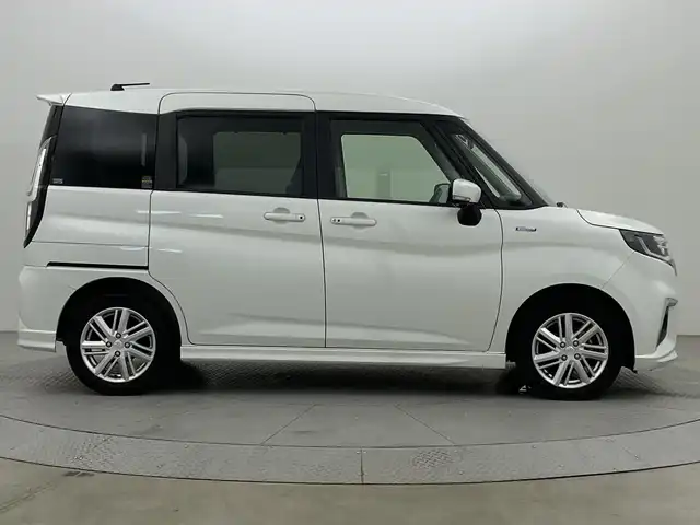 スズキ ソリオ HV MZ 新潟県 2021(令3)年 2.1万km ピュアホワイトP スズキセーフティサポート/禁煙車/ワンオーナー/純正9インチメモリナビ/　　CD/DVD/AM/FM/BT/フルセグ//　　applecarplay/androidauto/アラウンドビューモニター/両側パワースライドドア/アダプティブクルーズコントロール/LEDオートライト/前席シートヒーター/純正15インチアルミホイール付/ステアリングスイッチ/サーキュレーター/アイドリングストップ/ヘッドアップディスプレイ/USBポート/社外ドライブレコーダー/後席パーソナルテーブル/後席ロールサンシェード/スペアキー/スマートキー/ETC