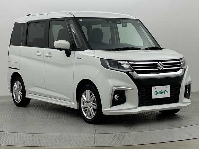 スズキ ソリオ HV MZ 新潟県 2021(令3)年 2.1万km ピュアホワイトP スズキセーフティサポート/禁煙車/ワンオーナー/純正9インチメモリナビ/　　CD/DVD/AM/FM/BT/フルセグ//　　applecarplay/androidauto/アラウンドビューモニター/両側パワースライドドア/アダプティブクルーズコントロール/LEDオートライト/前席シートヒーター/純正15インチアルミホイール付/ステアリングスイッチ/サーキュレーター/アイドリングストップ/ヘッドアップディスプレイ/USBポート/社外ドライブレコーダー/後席パーソナルテーブル/後席ロールサンシェード/スペアキー/スマートキー/ETC
