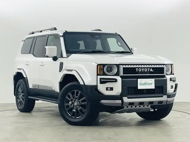 トヨタ ランドクルーザー ２５０ VX 福島県 2024(令6)年 0.5万km プラチナホワイトパールマイカ サンルーフ/丸目ライト/モデリスタ/・フロントバンパーガード/・フロントアンダーカバー/・シグネチャーイルミブレード/・オーバーフェンダー/・フェンダーガーニッシュ/・サイドモール/・リヤバンパーガーニッシュ/・リヤバンパーステップガード/・リヤスポイラー/アドバンスドドライブ/・FCTA/LCA/・ドライバーモニターカメラ/トヨタセーフティセンス/・PCS/LDA/PDA/BSM/・RCTA/RCD/RSA/PKSB/・レーダークルーズコントロール/・後方車接近告知/・安心降車サポート/・周辺車両接近時サポート/・クリアランスソナー/純正12.3型ディスプレイ/・フルセグTV/ナビ/BT/USB/HDMI/・全方位カメラ/・ドライブレコーダー/・ETC2.0/・デジタルインナーミラー/パワーバックドア/ルーフレール/サイドステップ/電子パーキング/・オートホールド/革巻きステアリング/・ステアリングリモコン/・ステアリングヒーター/レザーシート/・Dパワーシート/・D/Nシートヒーター/・D/Nエアシート/プッシュスタート/・スマートキー×2/LEDヘッドライト/・オートライト/・フォグ/・オートハイビーム/ワンオーナー