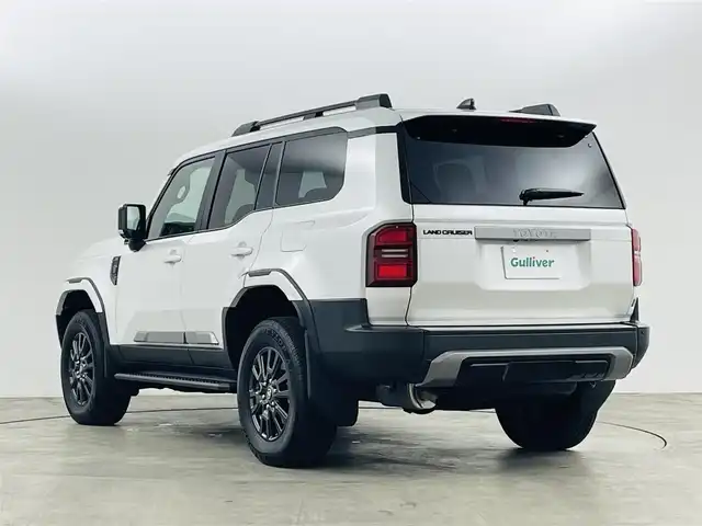 トヨタ ランドクルーザー ２５０ VX 福島県 2024(令6)年 0.5万km プラチナホワイトパールマイカ サンルーフ/丸目ライト/モデリスタ/・フロントバンパーガード/・フロントアンダーカバー/・シグネチャーイルミブレード/・オーバーフェンダー/・フェンダーガーニッシュ/・サイドモール/・リヤバンパーガーニッシュ/・リヤバンパーステップガード/・リヤスポイラー/アドバンスドドライブ/・FCTA/LCA/・ドライバーモニターカメラ/トヨタセーフティセンス/・PCS/LDA/PDA/BSM/・RCTA/RCD/RSA/PKSB/・レーダークルーズコントロール/・後方車接近告知/・安心降車サポート/・周辺車両接近時サポート/・クリアランスソナー/純正12.3型ディスプレイ/・フルセグTV/ナビ/BT/USB/HDMI/・全方位カメラ/・ドライブレコーダー/・ETC2.0/・デジタルインナーミラー/パワーバックドア/ルーフレール/サイドステップ/電子パーキング/・オートホールド/革巻きステアリング/・ステアリングリモコン/・ステアリングヒーター/レザーシート/・Dパワーシート/・D/Nシートヒーター/・D/Nエアシート/プッシュスタート/・スマートキー×2/LEDヘッドライト/・オートライト/・フォグ/・オートハイビーム/ワンオーナー