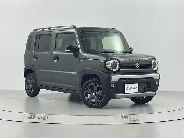 スズキ ハスラー タフワイルド 埼玉県 2024(令6)年 0.3万km クールカーキPM メーカー9インチナビ（TV/DVD/BT）/全方位カメラ/クリアランスソナー/スズキセーフティサポート/衝突軽減システム/レーンキープアシスト/追従型クルーズコントロール/純正アルミ/LEDヘッドライト＆フォグランプ/シートヒーター