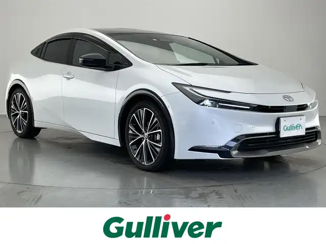 トヨタ プリウス Z 愛知県 2023(令5)年 3.8万km プラチナホワイトパールマイカ 純正１２．３型ＤＡフルセグＴＶ　ＨＤＭＩ　パノラマルーフ　全方位カメラ　デジタルインナーミラー　電動リアゲート　トヨタチームメイト　黒革　シートヒーター　ワイヤレス充電　衝突軽減　追従クルコン　アドバンスドパーク　トヨタセーフティセンス　コーナーセンサー　ＬＥＤオートライト　シートベンチレーション　ハンドルヒーター　ＡＣ100Ｖ電源　ＢＳＭ　内蔵型前後ドラレコ　禁煙車