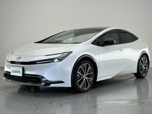 トヨタ プリウス Z 愛知県 2023(令5)年 3.8万km プラチナホワイトパールマイカ 純正１２．３型ＤＡフルセグＴＶ　ＨＤＭＩ　パノラマルーフ　全方位カメラ　デジタルインナーミラー　電動リアゲート　トヨタチームメイト　黒革　シートヒーター　ワイヤレス充電　衝突軽減　追従クルコン　アドバンスドパーク　トヨタセーフティセンス　コーナーセンサー　ＬＥＤオートライト　シートベンチレーション　ハンドルヒーター　ＡＣ100Ｖ電源　ＢＳＭ　内蔵型前後ドラレコ　禁煙車