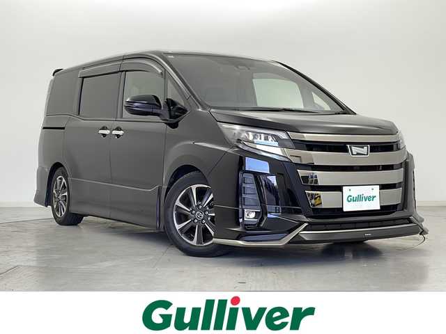 トヨタ ノア Si ダブルバイビー 宮城県 2018(平30)年 5万km ブラック モデリスタエアロ　/両側パワースライドドア/ハーフレザーシート/トヨタセーフティセンス/・プリクラッシュセーフティ/・レーンディパチャーアラート/・オートハイビーム　/純正10型ナビ/・CD・DVD・BT・USB・SD　/フルセグTV/バックカメラ　/ＬＥＤヘッドライト　/ＬＥＤフォグライト　/純正ドライブレコーダー（フロント）/クルーズコントロール　/ビルドインＥＴＣ　/純正フロアマット/純正ドアバイザー/純正16インチアルミホイール/アイドリングストップ/横滑り防止装置/ロールサンシェード