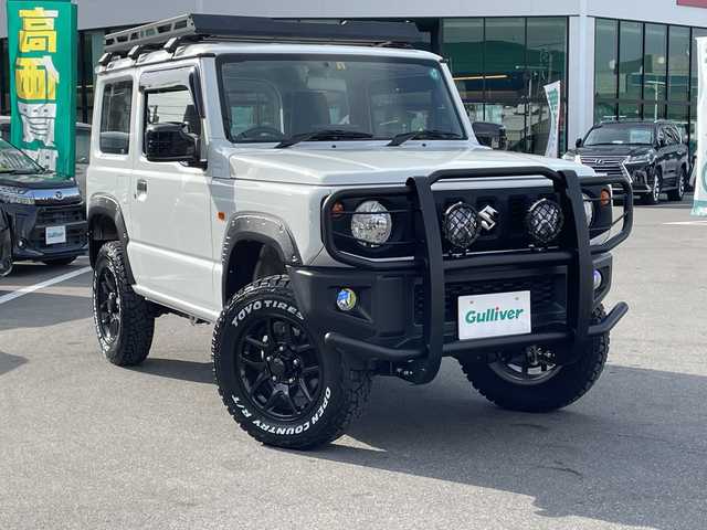 スズキ ジムニー XG 長野県 2023(令5)年 2.7万km スペリアホワイト 禁煙車/4WD/10インチフローティングマルチオーディオ/Bluetooth/社外スロットルコントローラー/グリルガード/オーバーフェンダー/背面タイヤカバー/1.5インチリフトアップキット/ルーフラック/リアラダー/純正足回り車載/ETC/純正アルミホイール/ダウンヒルアシスト/フォグランプ/LEDヘッドライト/オートライト/横滑り防止装置/ABS/ドアバイザー/リモコンキー/アイドリングストップ/パワーウインドウ/パワーステアリング/新車時保証書/取扱説明書