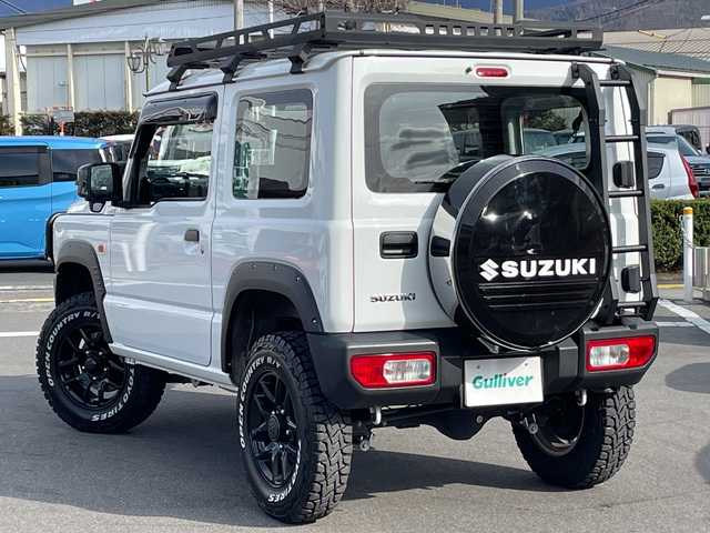 スズキ ジムニー XG 長野県 2023(令5)年 2.7万km スペリアホワイト 禁煙車/4WD/10インチフローティングマルチオーディオ/Bluetooth/社外スロットルコントローラー/グリルガード/オーバーフェンダー/背面タイヤカバー/1.5インチリフトアップキット/ルーフラック/リアラダー/純正足回り車載/ETC/純正アルミホイール/ダウンヒルアシスト/フォグランプ/LEDヘッドライト/オートライト/横滑り防止装置/ABS/ドアバイザー/リモコンキー/アイドリングストップ/パワーウインドウ/パワーステアリング/新車時保証書/取扱説明書