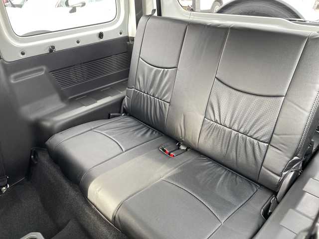 スズキ ジムニー XG 長野県 2023(令5)年 2.7万km スペリアホワイト 禁煙車/4WD/10インチフローティングマルチオーディオ/Bluetooth/社外スロットルコントローラー/グリルガード/オーバーフェンダー/背面タイヤカバー/1.5インチリフトアップキット/ルーフラック/リアラダー/純正足回り車載/ETC/純正アルミホイール/ダウンヒルアシスト/フォグランプ/LEDヘッドライト/オートライト/横滑り防止装置/ABS/ドアバイザー/リモコンキー/アイドリングストップ/パワーウインドウ/パワーステアリング/新車時保証書/取扱説明書