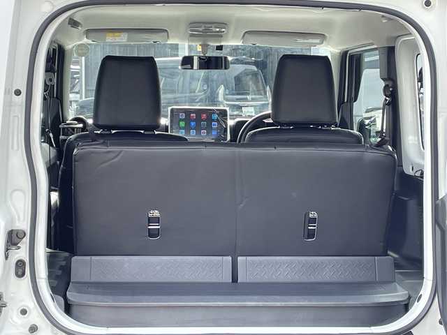 スズキ ジムニー XG 長野県 2023(令5)年 2.7万km スペリアホワイト 禁煙車/4WD/10インチフローティングマルチオーディオ/Bluetooth/社外スロットルコントローラー/グリルガード/オーバーフェンダー/背面タイヤカバー/1.5インチリフトアップキット/ルーフラック/リアラダー/純正足回り車載/ETC/純正アルミホイール/ダウンヒルアシスト/フォグランプ/LEDヘッドライト/オートライト/横滑り防止装置/ABS/ドアバイザー/リモコンキー/アイドリングストップ/パワーウインドウ/パワーステアリング/新車時保証書/取扱説明書