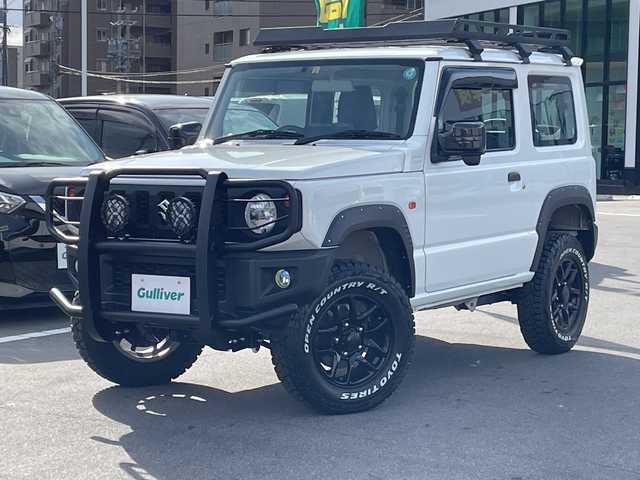 スズキ ジムニー XG 長野県 2023(令5)年 2.7万km スペリアホワイト 禁煙車/4WD/10インチフローティングマルチオーディオ/Bluetooth/社外スロットルコントローラー/グリルガード/オーバーフェンダー/背面タイヤカバー/1.5インチリフトアップキット/ルーフラック/リアラダー/純正足回り車載/ETC/純正アルミホイール/ダウンヒルアシスト/フォグランプ/LEDヘッドライト/オートライト/横滑り防止装置/ABS/ドアバイザー/リモコンキー/アイドリングストップ/パワーウインドウ/パワーステアリング/新車時保証書/取扱説明書